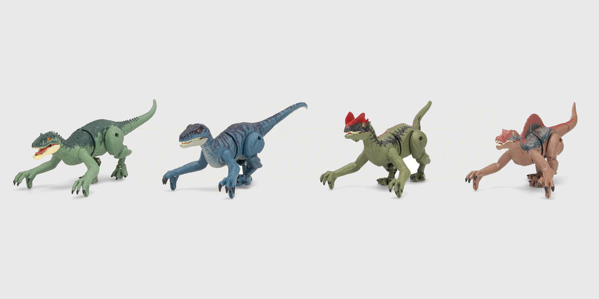Farverige små dinosaurer i forskellige former og farver vist sammen på en hvid baggrund.