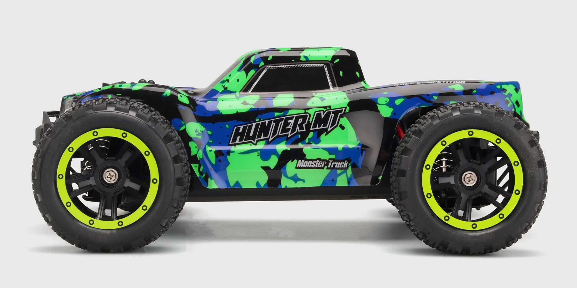 Grøn Hunter MT10 monster truck set fra siden på hvid baggrund.
