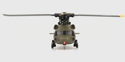 Rød og sort Top Hunter helikopter med fire propeller flyvende i luften mod en klar blå himmel.