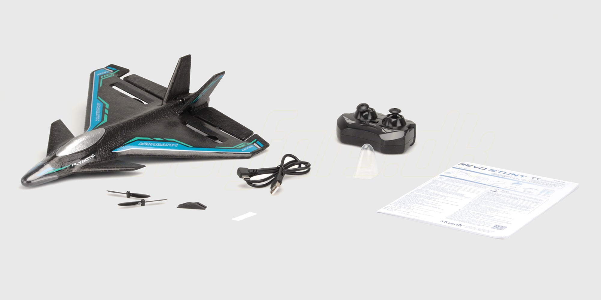 Revo Stunt med sender, ladekabel, reservepropeller og manual